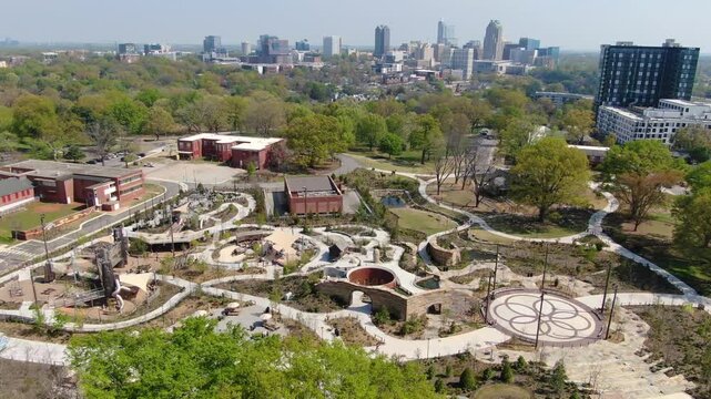 Aerial Drone Footage of Gipson Play Plaza at Dorothea Dix Park with Raleigh Skyline