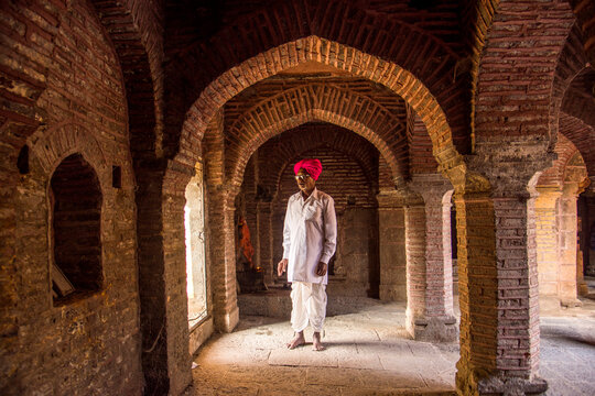 An Indian man prays at a Temple, India