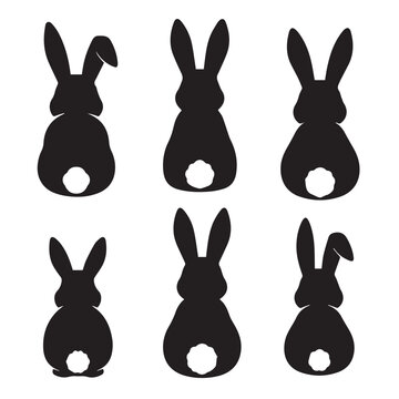 Black rabbit silhouettes sitting on a white background Vector