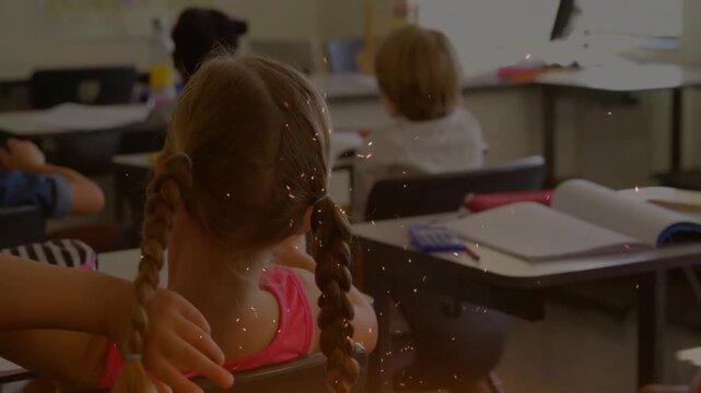 Hand emerging from left grabbing braid and swinging gently creating distraction in school class