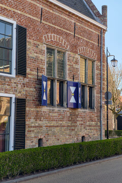 Historical Preservation And Cultural Heritage In Franeker Netherlands A Historic Brick Orphanage Building With Decorative Shutters And Traditional Architecture