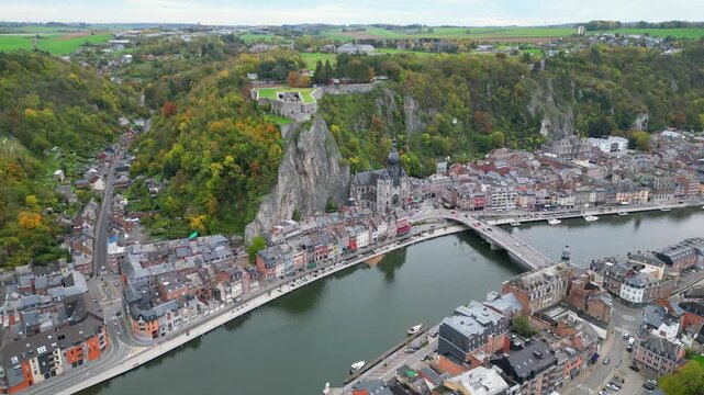 Aerial view of Dinant city with the Collegiate Church of Notre-Dame, the Citadel on the cliff and Meuse river, under soft light, Belgium. #3