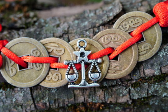 Chinese feng Shui coins and a libra figurine.