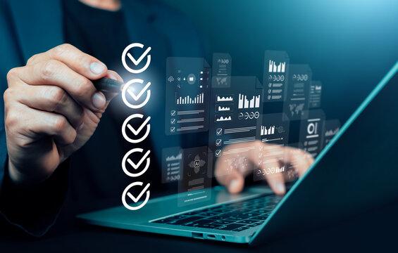 Business professional checking digital checklist and data analytics dashboard on laptop screen, concept of project management, quality control, workflow automation, compliance audit, and AI technology