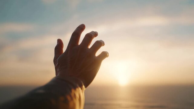 A human hand reaches towards a radiant sun setting over a calm, expansive ocean. Capturing a moment of aspiration, hope, and connection. ..Created with Generative AI, not depicting real subjects.