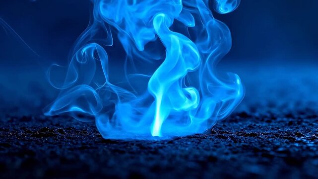 Blue smoke rising from textured surface