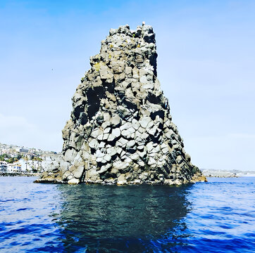 Acitrezza rocks of the Cyclops, sea stacks in Catania, Sicily, Italy.