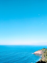 Obraz premium Aesthetic view of the Indian Ocean with calm waves and peaceful atmosphere, perfect serene ocean wallpaper background.