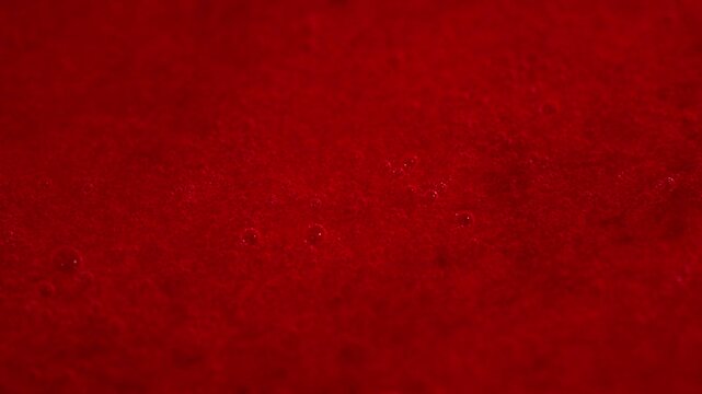 Macro Extreme Close-up of Fresh Red Strawberry Sauce or Jam with Bubbles, Stirring Texture for Food Ads