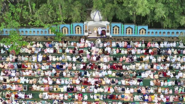 Muslim crowd praying salah together during eid festival