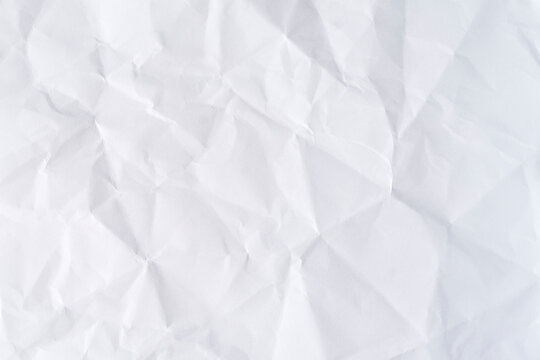 Crumpled white paper texture, clean minimal background