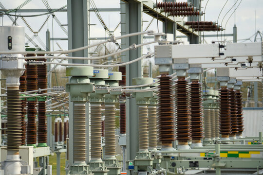 High voltage electrical substation with insulators and power lines in the Netherlands, energy grid infrastructure for energy transition