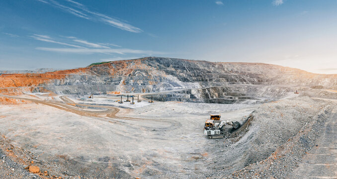Panoramic open pit mine landscape with heavy truck and quarry excavation for industrial background and banner mining project