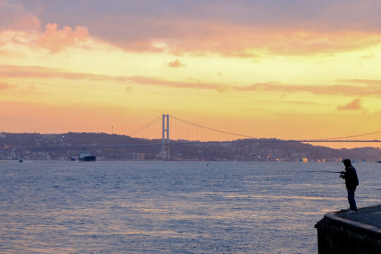 istanbul silhouette with a fishing man