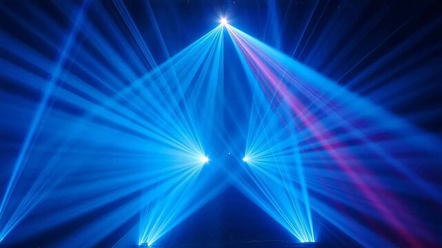 Stage lighting beams in blue and pink
