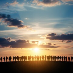 Obraz premium Silhouette of a large group of people standing together at sunset with clouds