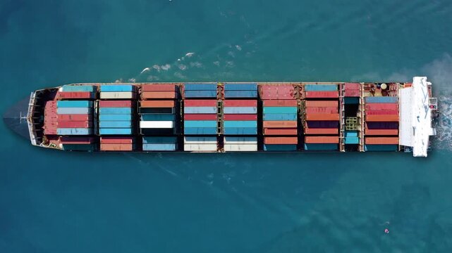 Container ship navigates busy shipping lanes during peak season for international trade and logistics operations
