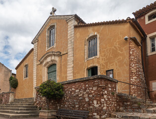 Obraz premium Eglise St Michel, Church of St Michel, Stone and Stucco, in the Villate of Rousillon, Provence, France.