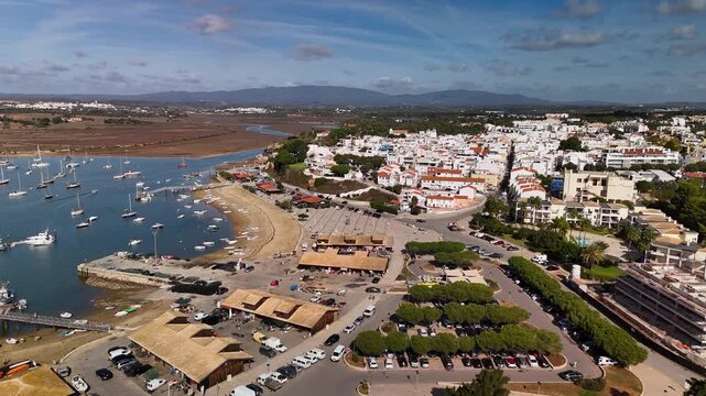 Aerial Pan of Alvor Fishing Village Marina and Coastal Architecture in Algarve Portugal