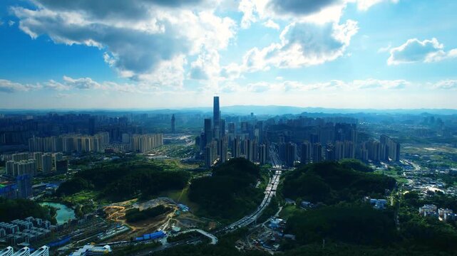 Aerial view of Guiyang CBD skyline with mountains and blue sky, Guizhou China