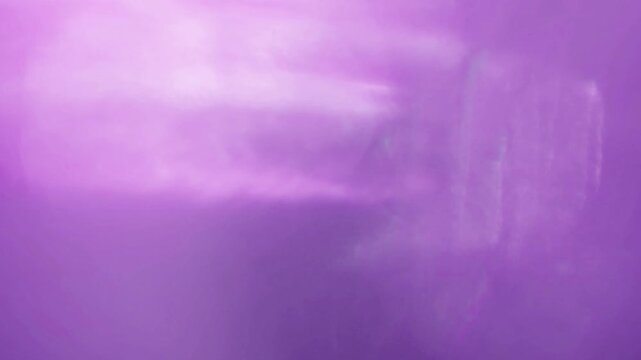 A seamless amber light transition with gentle illumination sweep and clean dissolve.