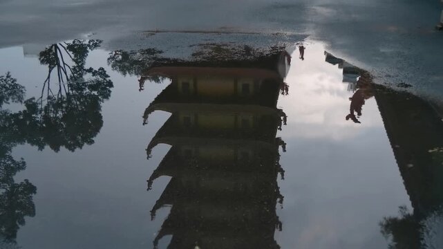 Tall multilayered tower of Viet Nam Quoc Tu Pagoda (Vietnamese National Pagoda) stands gracefully amongst traditional asian style bended tiled roofs with serpent like chofas
