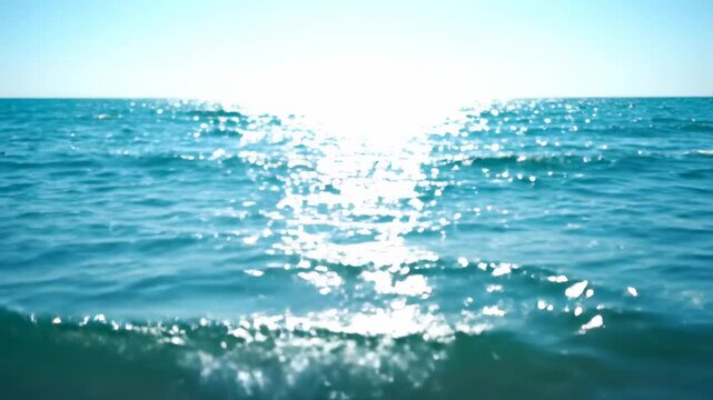 Serene Ocean Horizon with Bright Sun Glinting on Blue Sea Waves for Travel Backgrounds and Summer Vacation Promos.