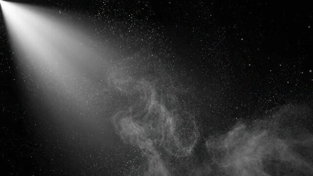 Dramatic Powder Explosion with Spotlight Beam on Black Background for Cinematic Backgrounds and Special Effects.