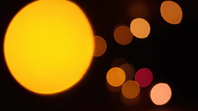 Golden Bokeh Lights Background with Soft Glowing Circles for Festive Celebrations and Cinematic Overlays.