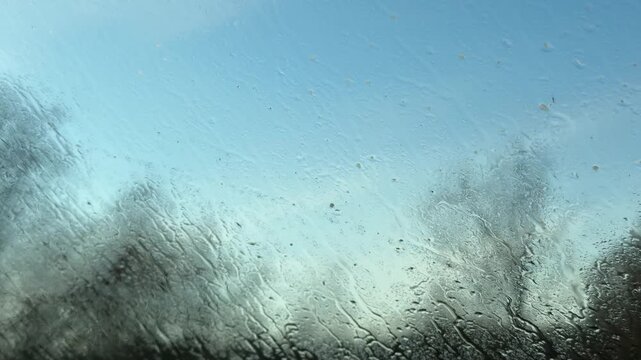 Car Interior View of Window Washed with Soap and Water