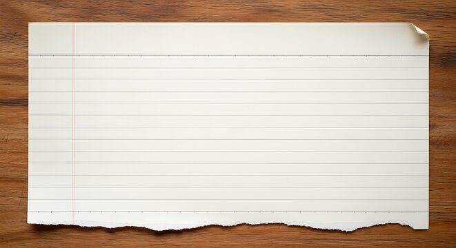 Aged lined notebook paper with torn edge on rustic wood background, vintage mockup space for text, paper texture