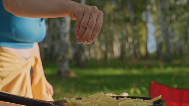 Outdoor cooking scene. Tranquil outdoor setting showcasing culinary activity and scenic beauty. Idyllic natural landscape where cooking takes place surrounded by sunshine and lush trees