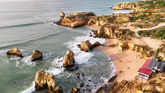 Bird's Eye Drone Circle of Praia dos Arrifes Beach and Coastal Rock Formations Albufeira Portugal