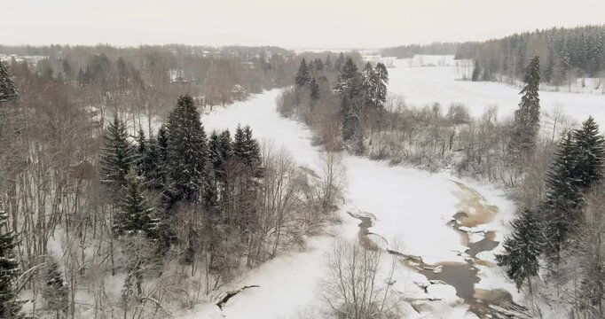 Aerial view of serene winter river scene in cloudy weather at Pitk&auml;koski rapids, Helsinki and Vantaa, Finland, Europe.