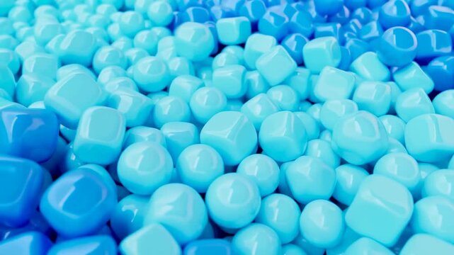 Slow motion close up of glossy blue rounded cubes shifting and sliding across surface in minimal studio setting