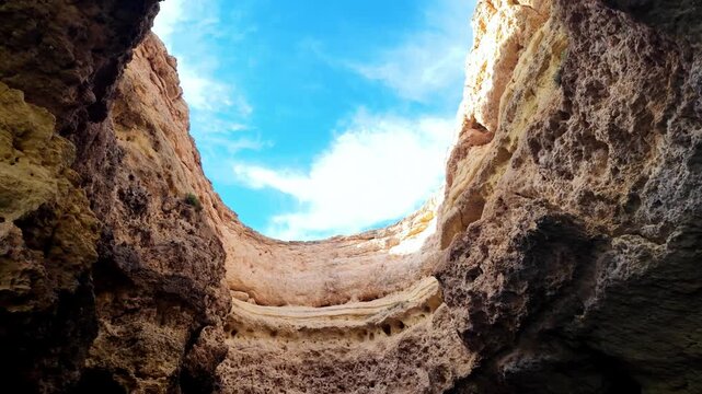 POV Boat Tour Inside Benagil Sea Cave Looking at Sky Through Natural Rock Opening