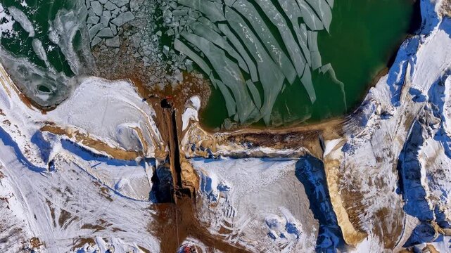 Winter aerial view featuring a frozen quarry in Dover, New Hampshire