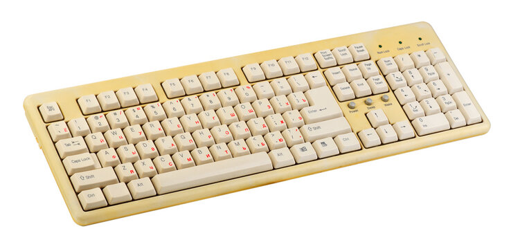 Vintage computer keyboard from the 1990s isolated on white background.