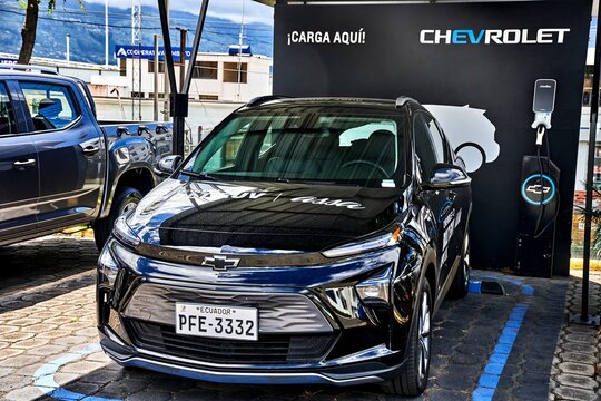 Ambato, Ecuador - June 09, 2025: Chevrolet electric vehicle parked at charging station in Ecuador, showcasing modern design and eco-friendly technology with vibrant surroundings