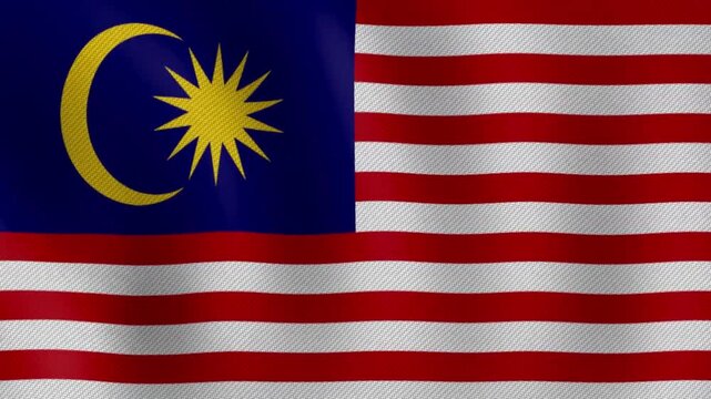Malaysia national flag waving in wind with crescent moon and star symbol on dark blue field