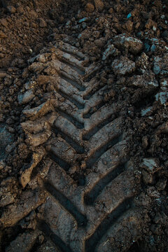 Tractor Tire Track in Fresh Soil &ndash; Deep Tread Mark, Agriculture, Farmland Texture and Machinery Impact on Earth