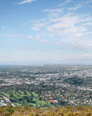 Obraz premium Skyline of Universal City as seen from the top of Cahuenga Peak at Wisdom Tree during a summer season in Los Angeles, California, USA
