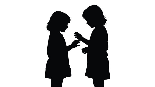 Two young girls exchange a small gift a striking silhouette