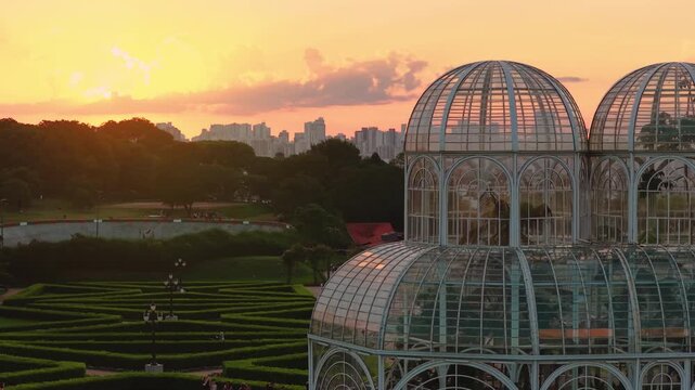 Curitiba botanical garden glasshouse with Curitiba city horizon and Curitiba sunset