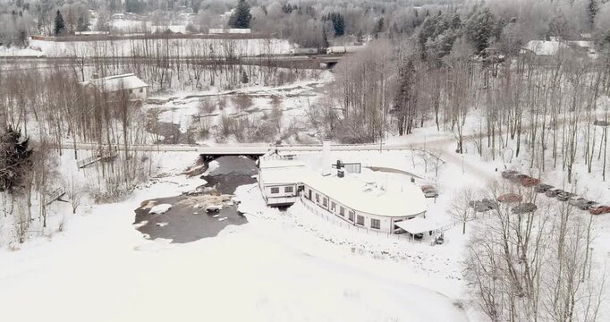 Aerial view of Vantaankoski rapids and Vanha Viilatehdas (The Old File Factory), which now operates as a restaurant and event venue in cloudy winter weather, Vantaa, Finland, Europe.