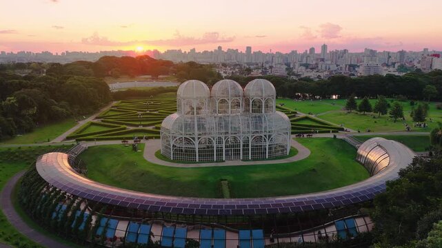 Curitiba botanical garden glasshouse with Curitiba city horizon and Curitiba sunset