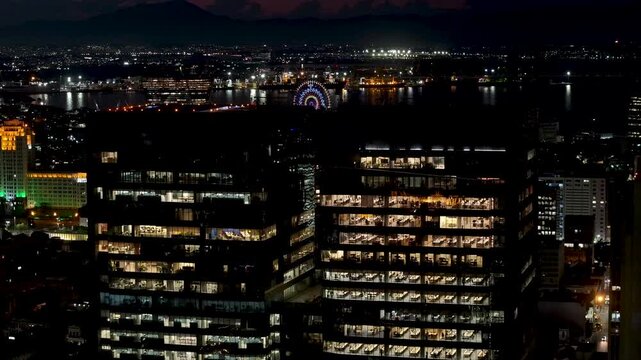 Corporate Buildings In Rio De Janeiro Brazil. Illuminated Ferris Wheel Landscape. Downtown District. Highrise Buildings. Corporate Buildings In Rio De Janeiro Brazil. Night Life Tourism. 