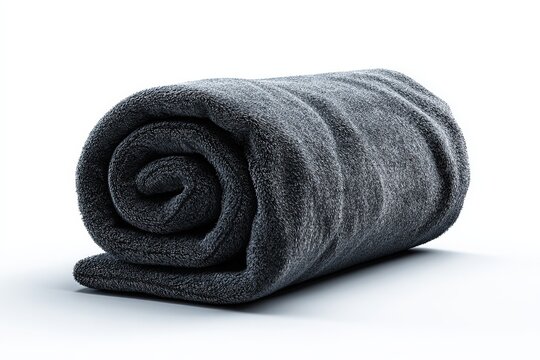 A tightly rolled, soft, dark grey blanket. Its texture suggests warmth and comfort.