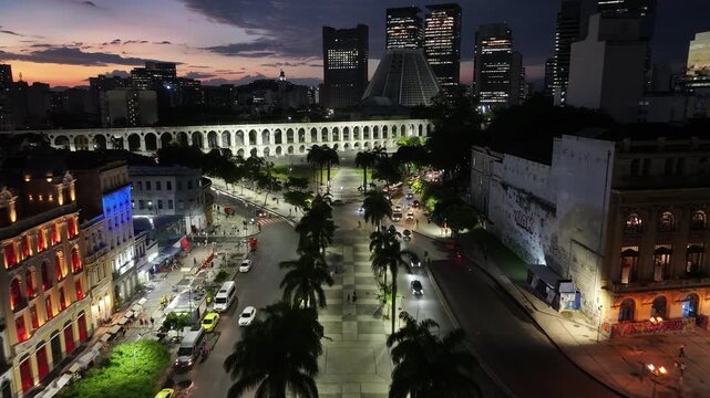Sunset Skyline In Arches Of Lapa In Rio De Janeiro In Brazil. Sunset Landscape. Downtown District. Landmark Monument. Sunset Skyline In Arches Of Lapa In Rio De Janeiro In Brazil. 