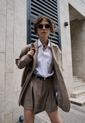 Obraz premium woman walking in the street, street style fashion.